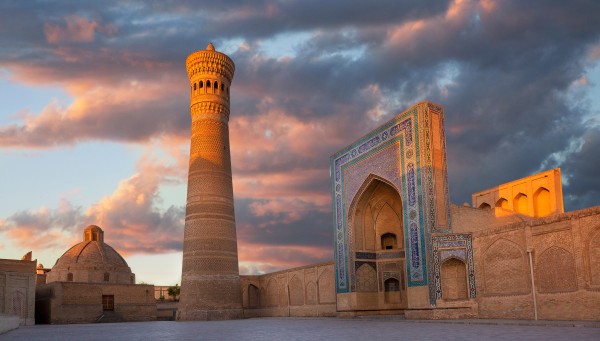 Kalon Minaret and historic Bukhara at sunset